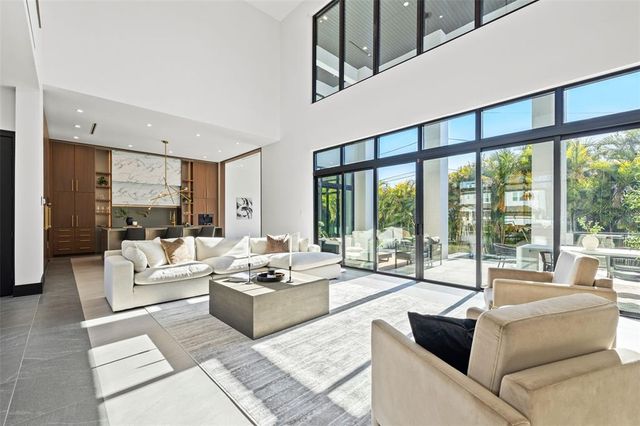 a kitchen with stainless steel appliances a sink stove and cabinets
