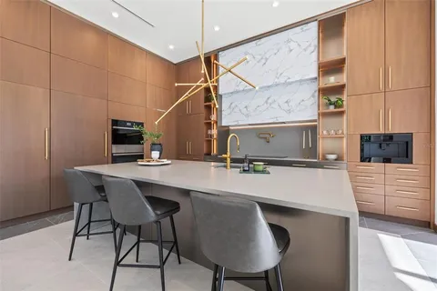 a work room with furniture and a large window