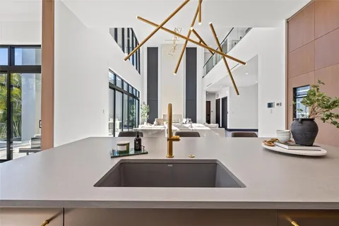 a kitchen with a sink and a refrigerator