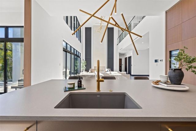 a kitchen with a sink and a refrigerator