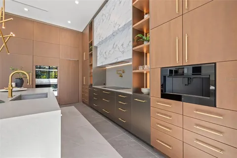 a spacious bedroom with a large bed and a wooden floor