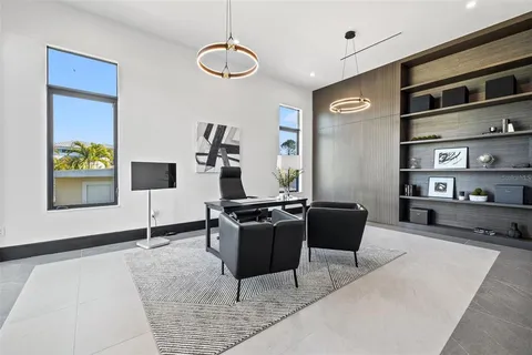 a spacious bathroom with a double vanity sink a mirror and a bathtub