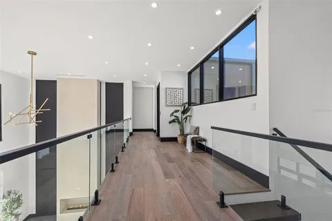 a bathroom with a shower sink and mirror