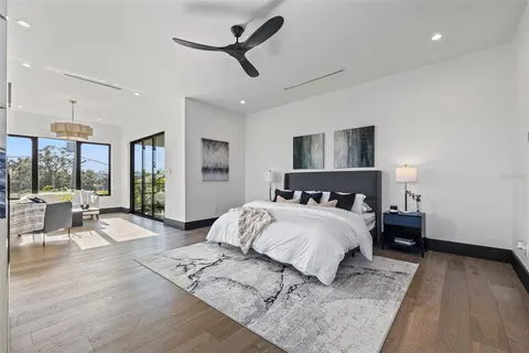 a view of a balcony with stainless steel appliances wooden floor and fence