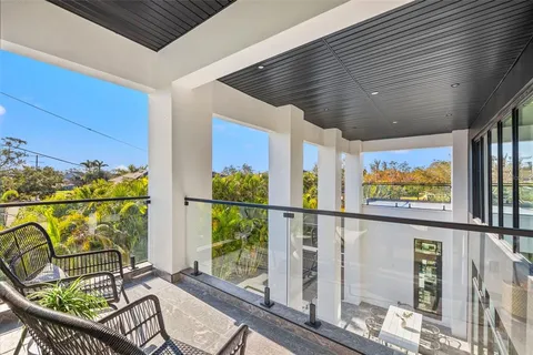 a view of a back yard with the wooden floor and a potted plant