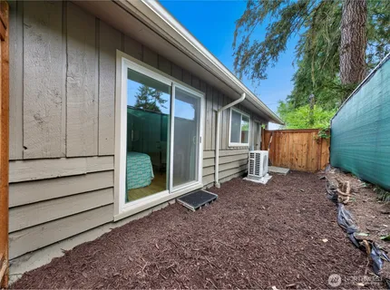 a house view with a backyard space