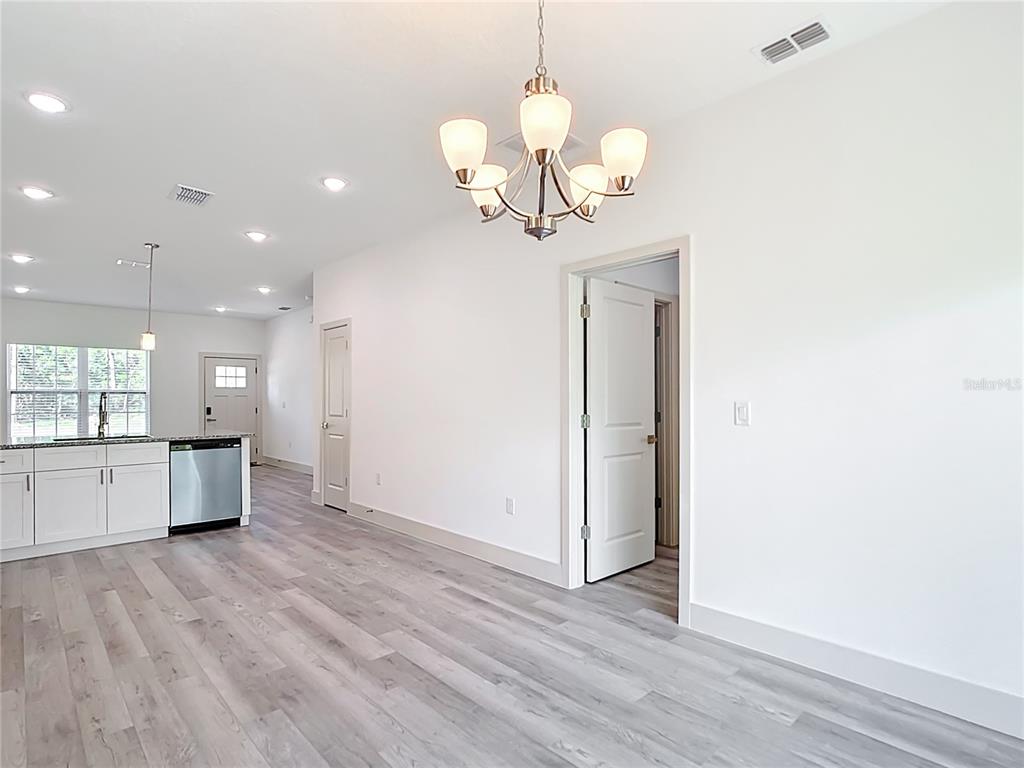 3525 Southwest 163rd Pl Road Ocala, FL 34473 - Photo 11 of 80 a view of a kitchen with a dishwasher and wooden floor