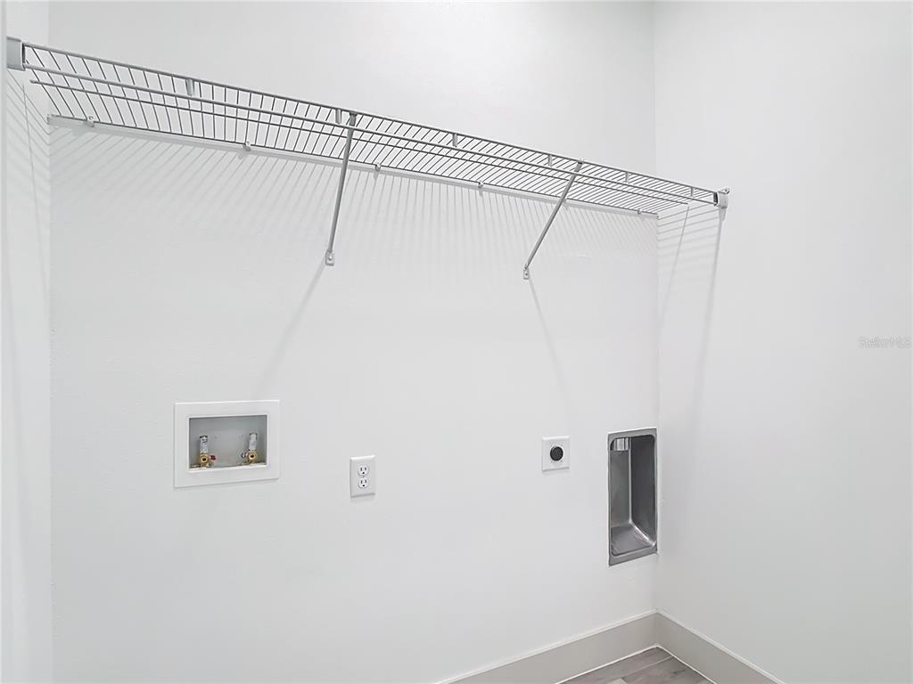 3525 Southwest 163rd Pl Road Ocala, FL 34473 - Photo 67 of 80 a view of a wall with rack on the wall