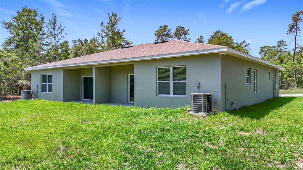 3525 Southwest 163rd Pl Road Ocala, FL 34473 - Photo 75 of 80 a view of a house with a yard