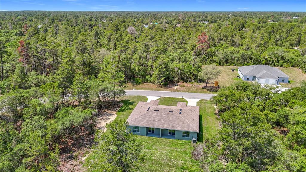 3525 Southwest 163rd Pl Road Ocala, FL 34473 - Photo 79 of 80 an aerial view of a house with a yard