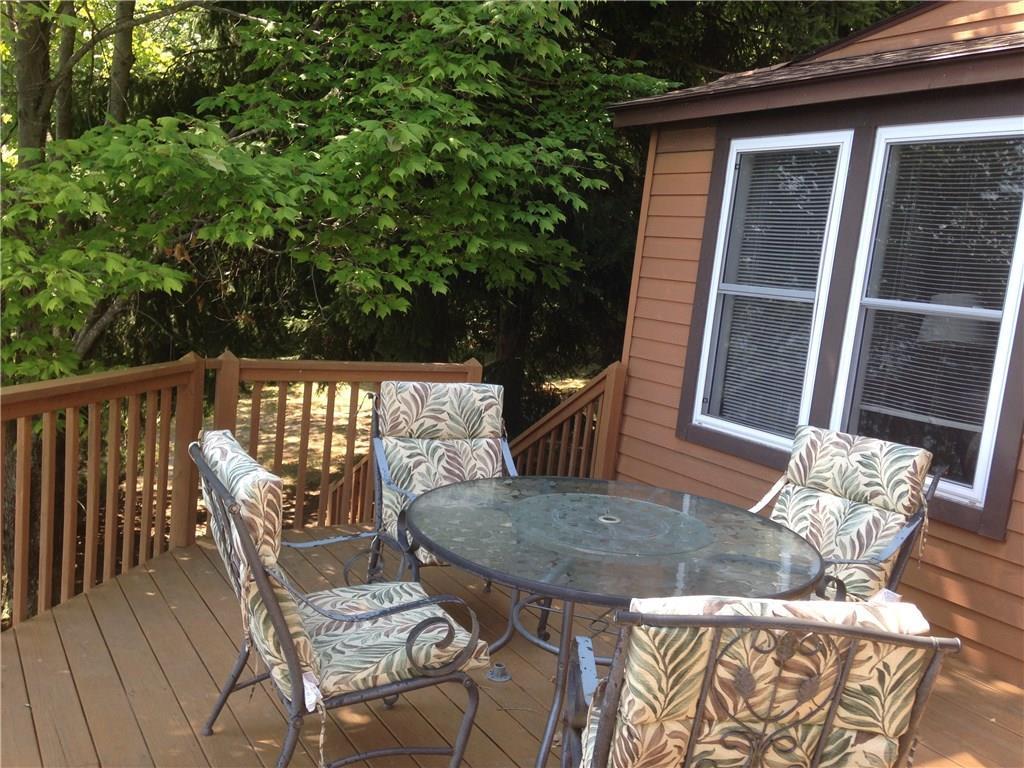 11 Sebaik Road Sebago, ME 04029 - Photo 15 of 35 SITTING AREA ON LARGE FRONT DECK