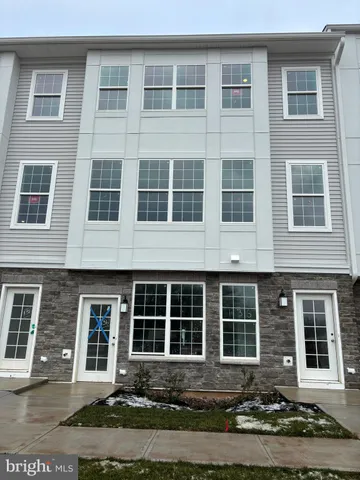 a front view of a building with windows