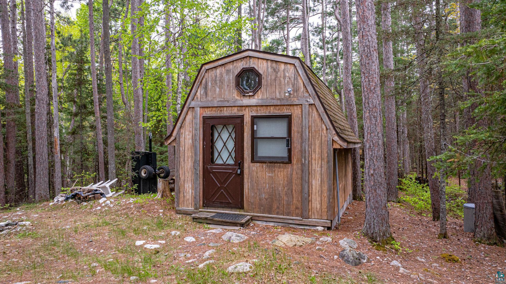 2260 Gold Mine Road Ely, MN 55731 - Photo 1 of 29 View of shed featuring a view of trees