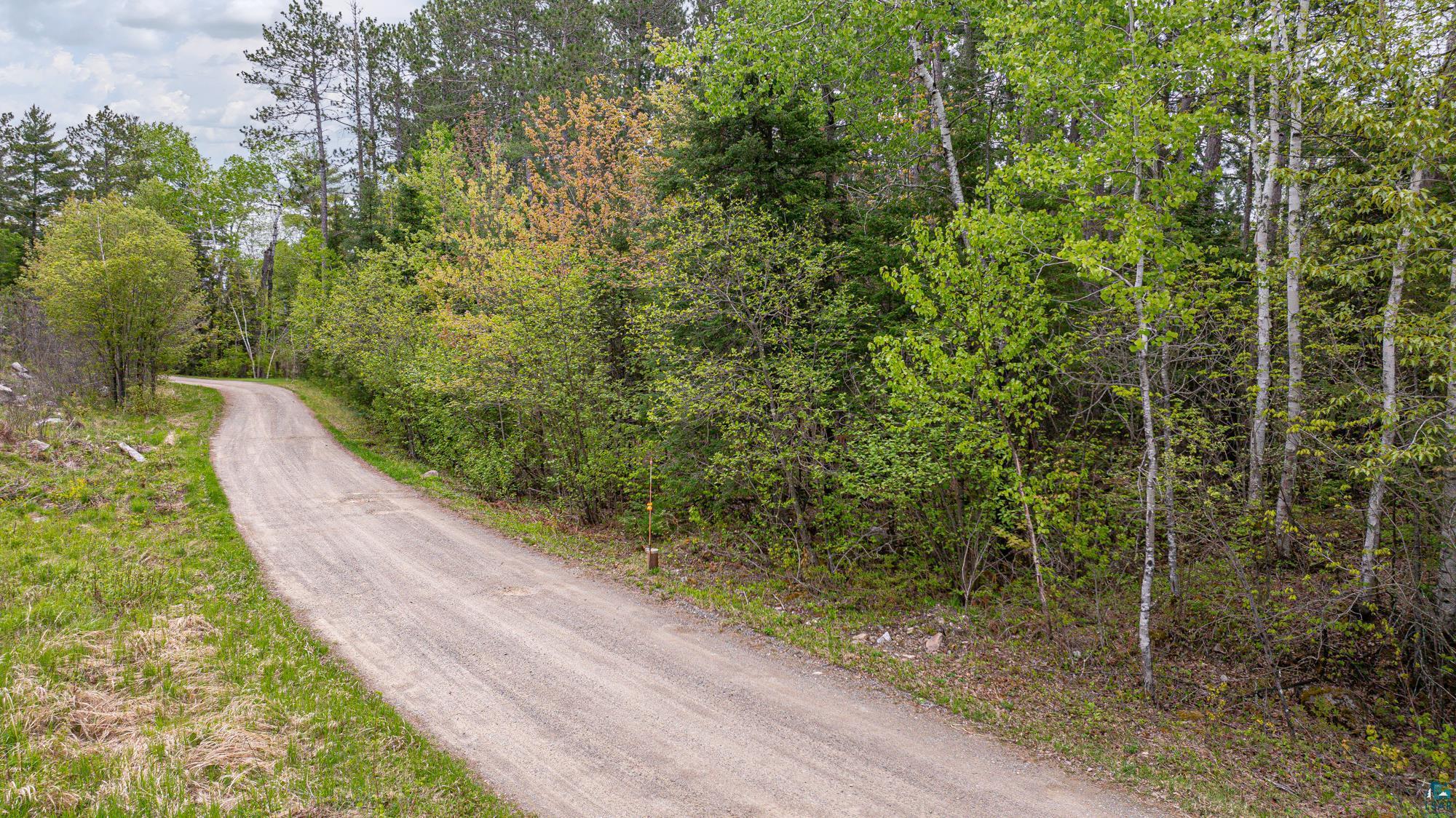2260 Gold Mine Road Ely, MN 55731 - Photo 14 of 29 View of dirt / gravel road featuring a wooded view