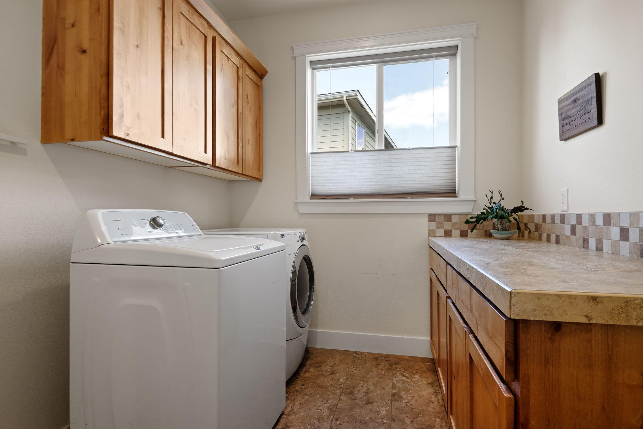 62944 Fresca Street Bend, OR 97703 - Photo 19 of 32 a utility room with dryer and washer