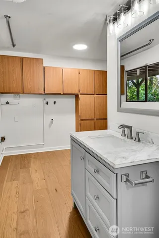 a kitchen with a sink and cabinets