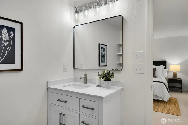 a bathroom with a sink and a mirror
