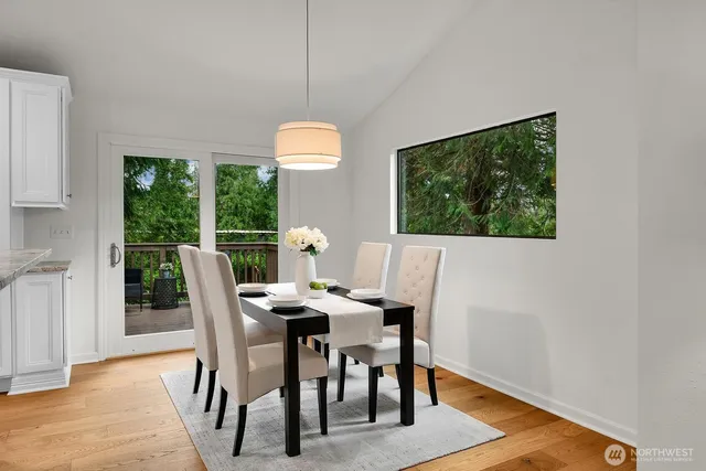 a view of a dining room with furniture window and outside view