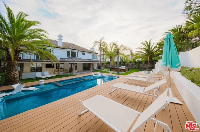 a bedroom with a bed and flat screen tv