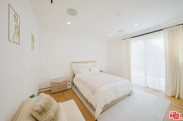a view of a house with pool and chairs