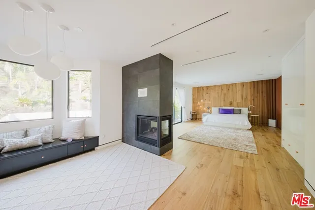a view of a house with swimming pool and sitting area