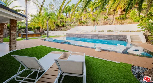 a view of a house with swimming pool