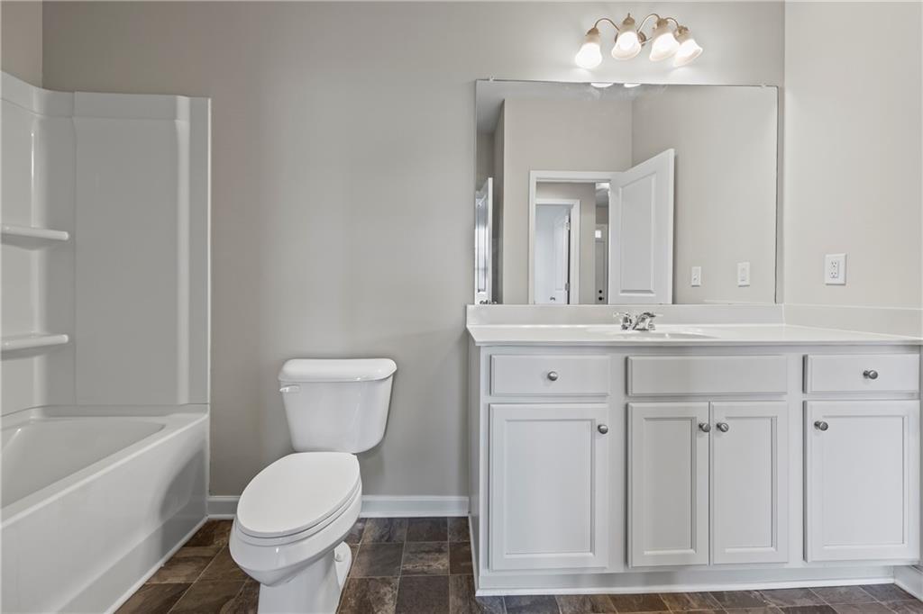 30 Fanleaf Drive Fairburn, GA 30213 - Photo 17 of 88 a bathroom with a toilet sink and mirror
