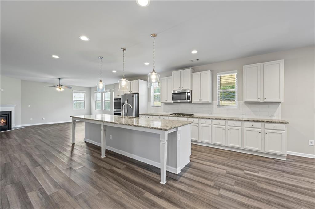 30 Fanleaf Drive Fairburn, GA 30213 - Photo 2 of 88 a kitchen with stainless steel appliances granite countertop refrigerator sink and cabinets