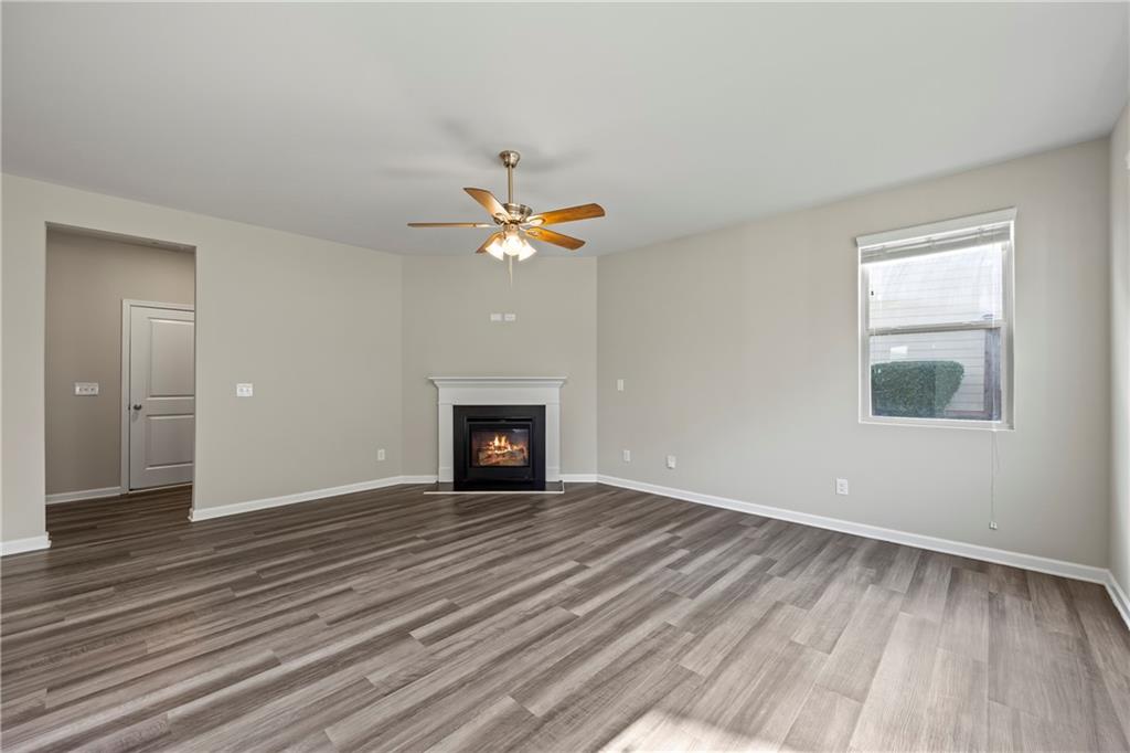 30 Fanleaf Drive Fairburn, GA 30213 - Photo 27 of 88 a view of an empty room with wooden floor and a window