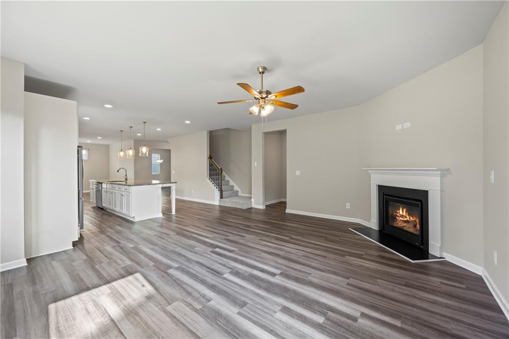 30 Fanleaf Drive Fairburn, GA 30213 - Photo 28 of 88 a view of an empty room with wooden floor and a fireplace
