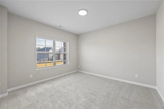 a bathroom with a double vanity sink a mirror and a bathtub