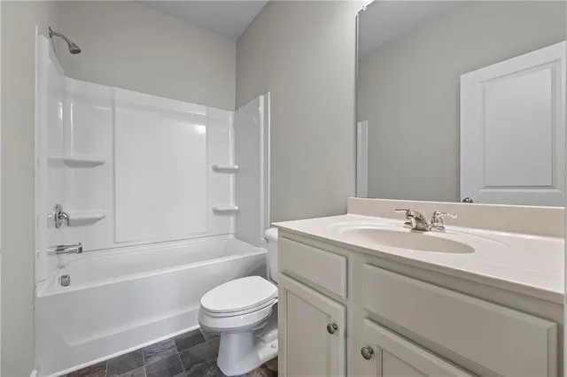 a bathroom with a sink a mirror and a shower