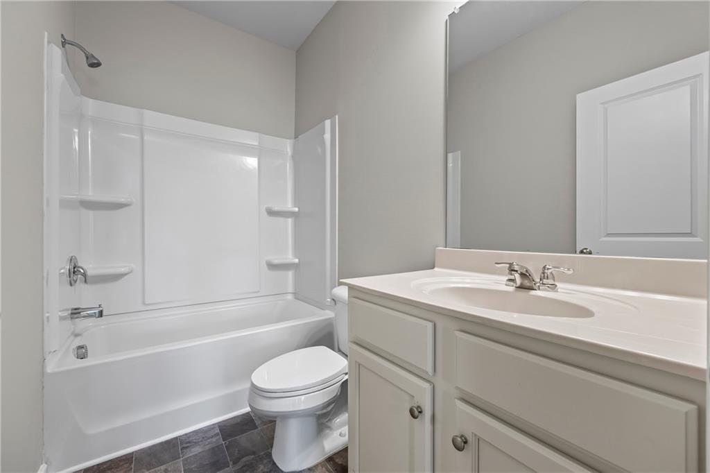 30 Fanleaf Drive Fairburn, GA 30213 - Photo 38 of 88 a bathroom with a sink a toilet and a bathtub