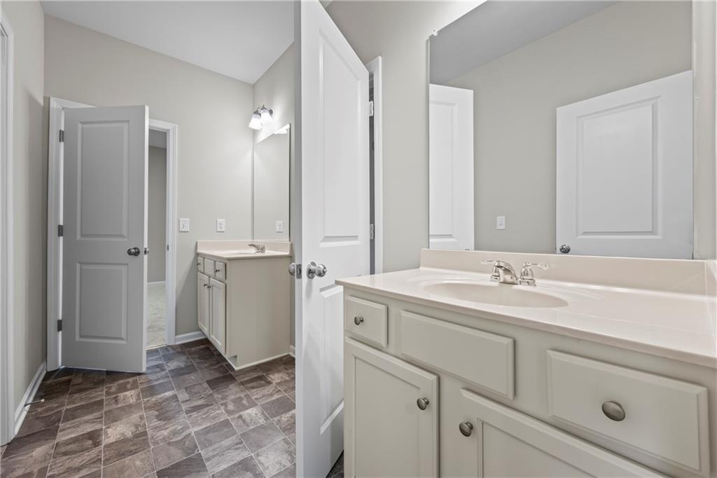 30 Fanleaf Drive Fairburn, GA 30213 - Photo 43 of 88 a bathroom with a sink and a mirror