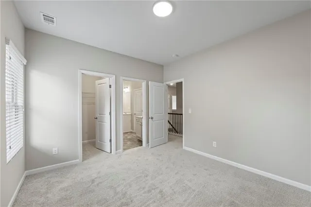 an aerial view of residential building and car parked on street side