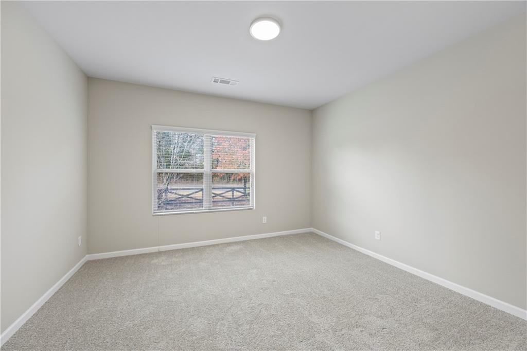 30 Fanleaf Drive Fairburn, GA 30213 - Photo 54 of 88 an empty room with a window