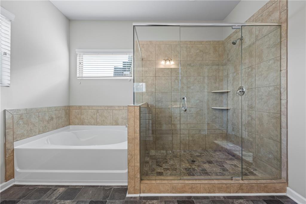 30 Fanleaf Drive Fairburn, GA 30213 - Photo 59 of 88 a bathroom with a shower and a bathtub