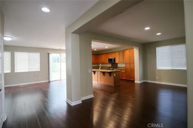 an open kitchen with cabinet and wooden floor