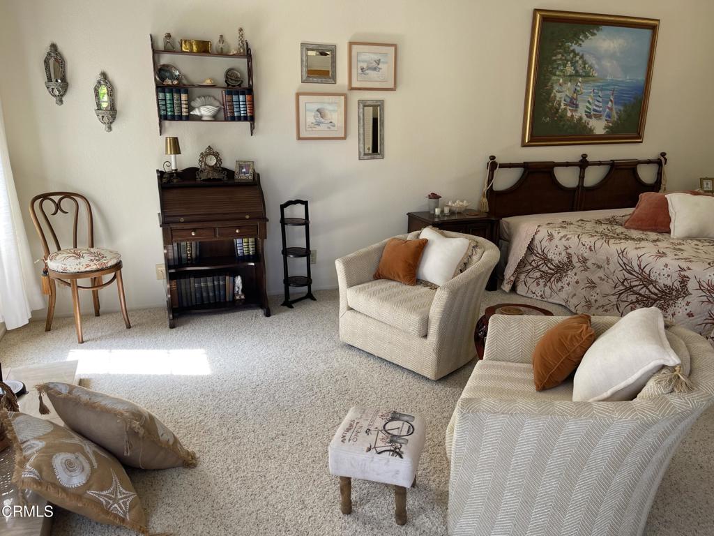 2240 Cannes Square Oxnard, CA 93035 - Photo 42 of 75 a bedroom with furniture and a couch