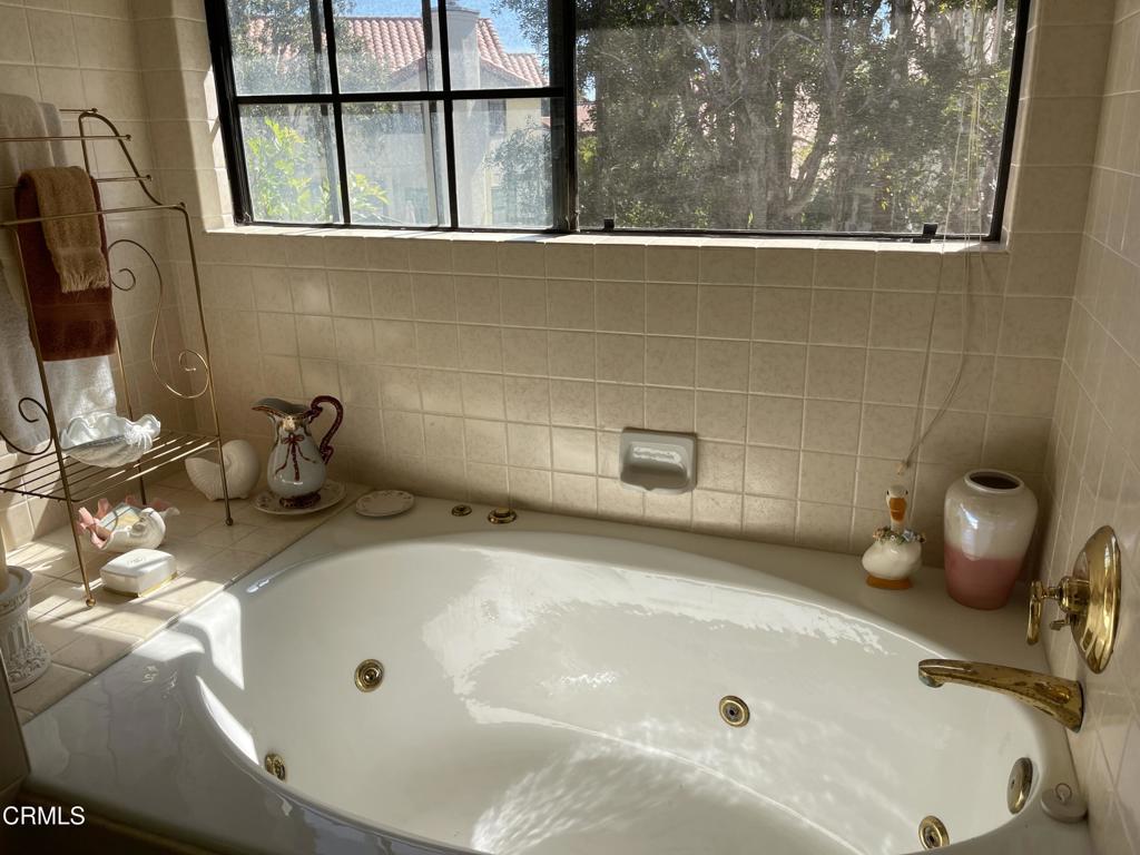 2240 Cannes Square Oxnard, CA 93035 - Photo 46 of 75 a bathroom with a tub and a sink