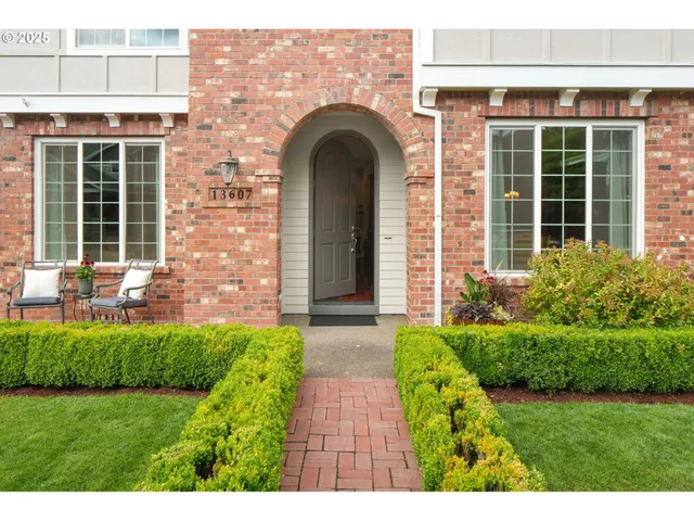a view of a house with potted plants