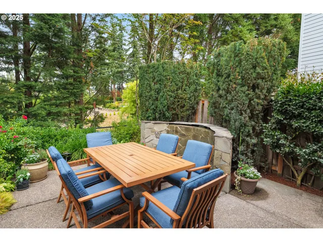 a view of a wooden bench and table in the patio