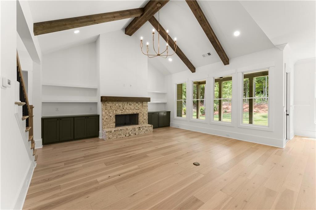 285 Reese Way Ball Ground, GA 30107 - Photo 13 of 30 a view of an empty room with a fireplace and a window