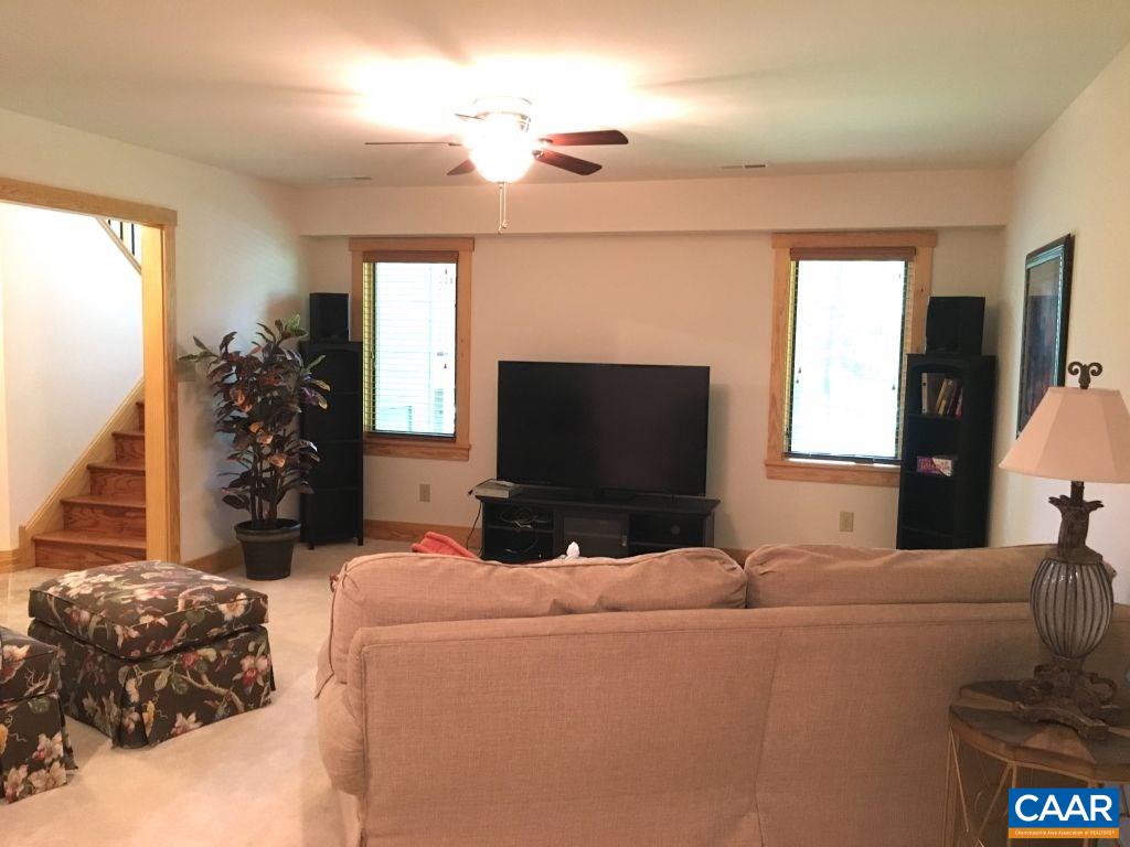 280 Fawn Ridge Drive Roseland, VA 22967 - Photo 13 of 19 a living room with furniture and a flat screen tv