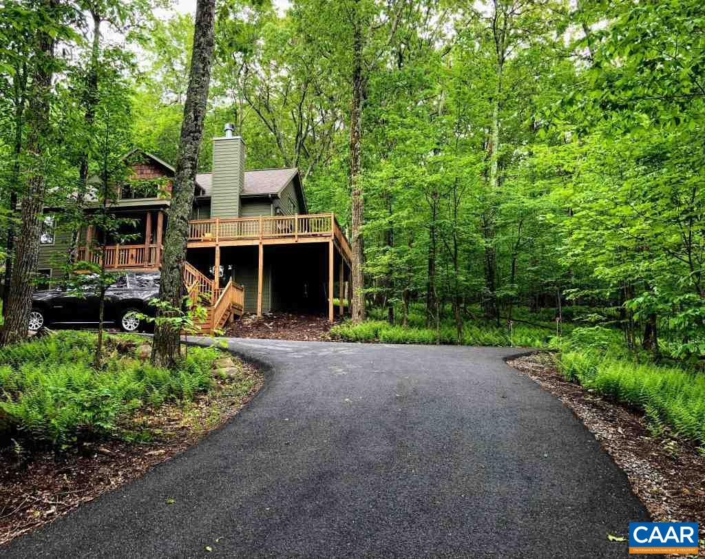 280 Fawn Ridge Drive Roseland, VA 22967 - Photo 2 of 19 a front view of a house with a yard and shrubs