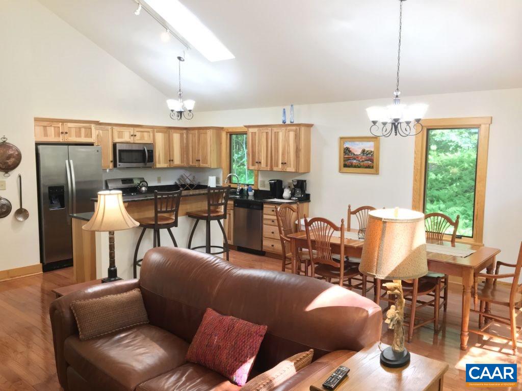 280 Fawn Ridge Drive Roseland, VA 22967 - Photo 8 of 19 a living room with furniture kitchen and a chandelier