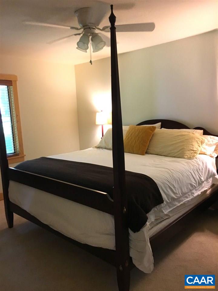 280 Fawn Ridge Drive Roseland, VA 22967 - Photo 10 of 19 a bedroom with a bed and a mirror