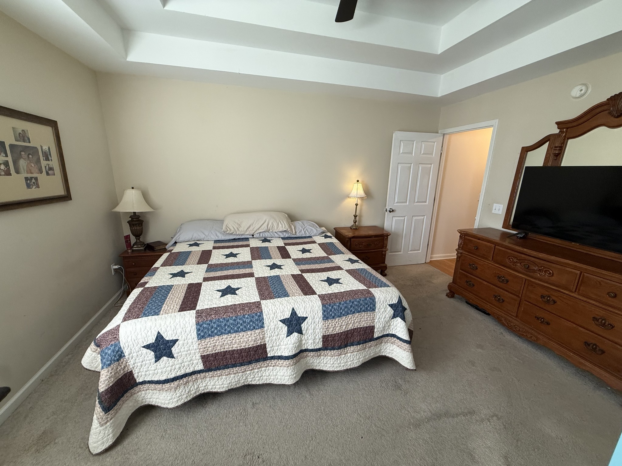 1702 Abiff Road Burns, TN 37029 - Photo 34 of 47 a bedroom with a bed and a flat screen tv