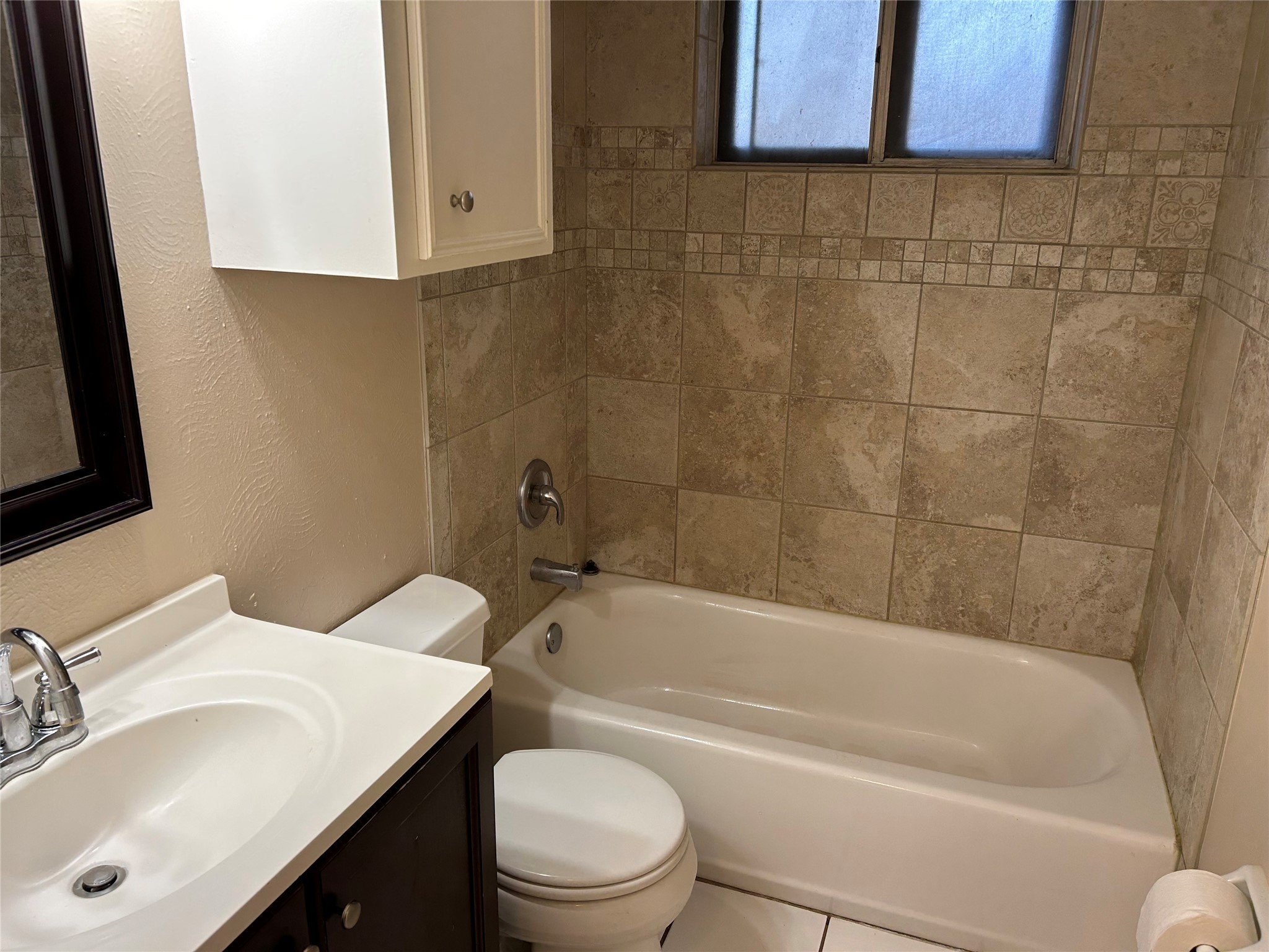 4146 Bermuda Drive Pasadena, TX 77503 - Photo 14 of 16 a bathroom with a sink a toilet and bathtub