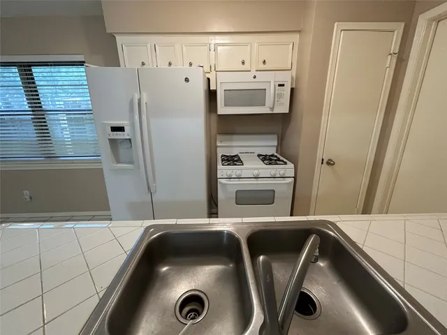 a bathroom with a sink and a washing machine